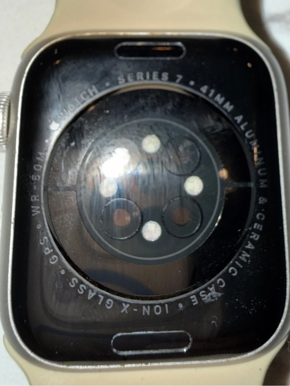 Apple Watch Series 7, 41mm with neutral Sport Band and Silver Aluminum Case